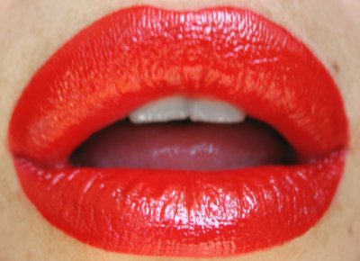 Red lipstick in action. Photo in public domain.
