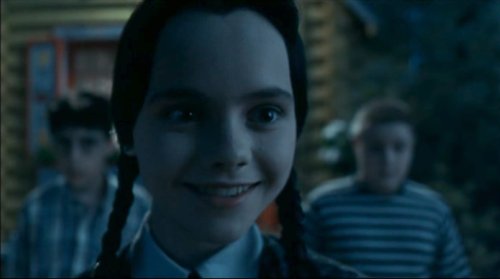 Wednesday Addams smiling.