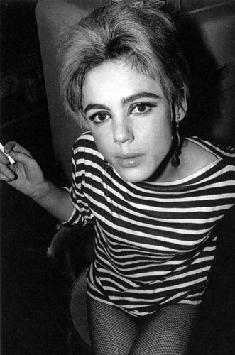 Edie, in striped boater shirt, with cigarette.