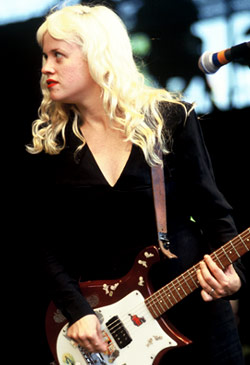 Kat Bjelland in a black and white babydoll dress.